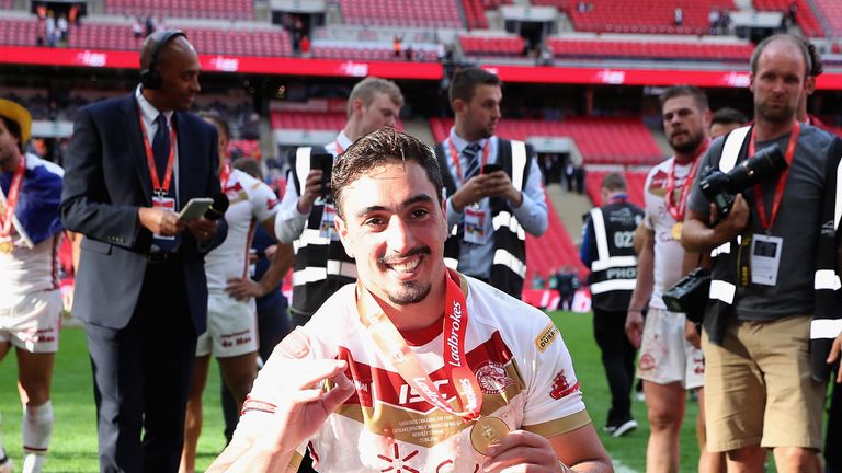 Tony Gigot of Catalans Dragons poses with the trophy after the Challenge Cup Final win over Warrington Wolves.