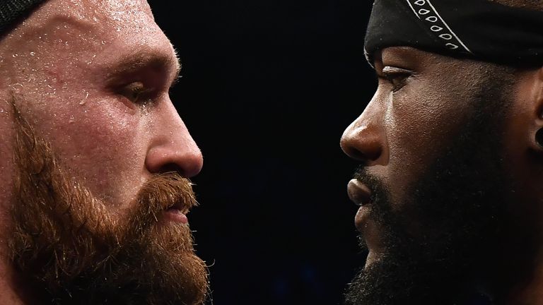 BELFAST, NORTHERN IRELAND - AUGUST 18: Tyson Fury is confronted by rival boxer Deontay Wilder after defeating Francesco Pianeta in a heavyweight contest at Windsor Park on August 18, 2018 in Belfast, Northern Ireland. (Photo by Charles McQuillan/Getty Images)