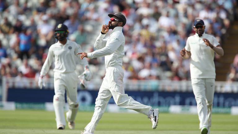 Virat Kohli celebrates after running Joe Root out during India's first Test against England