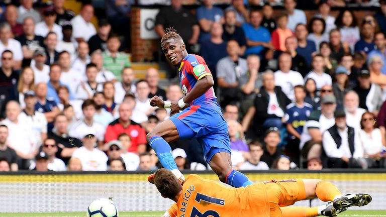 Wilfried Zaha of Crystal Palace scores his team's second goal past Fabricio Agosto Ramirez