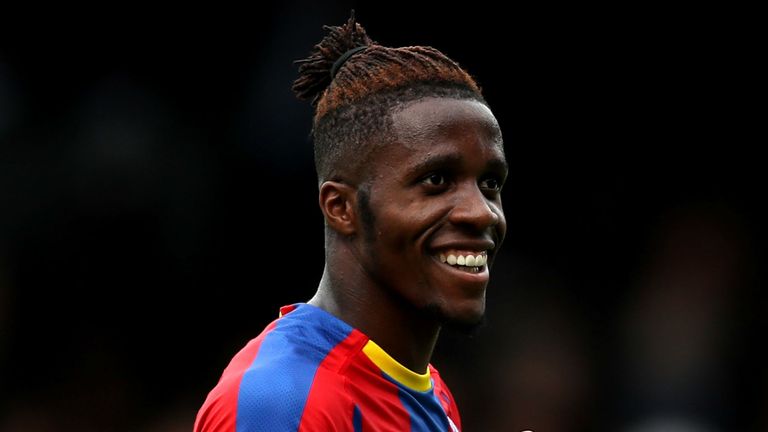 Wilfried Zaha of Crystal Palace celebrates following his sides victory in the Premier League match between Fulham FC and Crystal Palace at Craven Cottage on August 11, 2018 in London, United Kingdom.