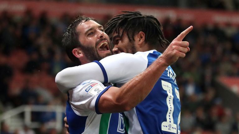 Wigan Athletic's Will Grigg celebrates scoring his side's third goal of the game from the penalty spot with Reece James