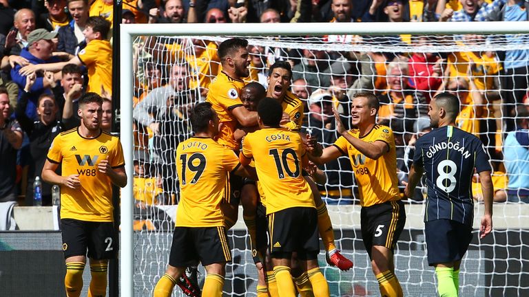 Willy Boly is mobbed by teammates after scoring the opening goal of the game