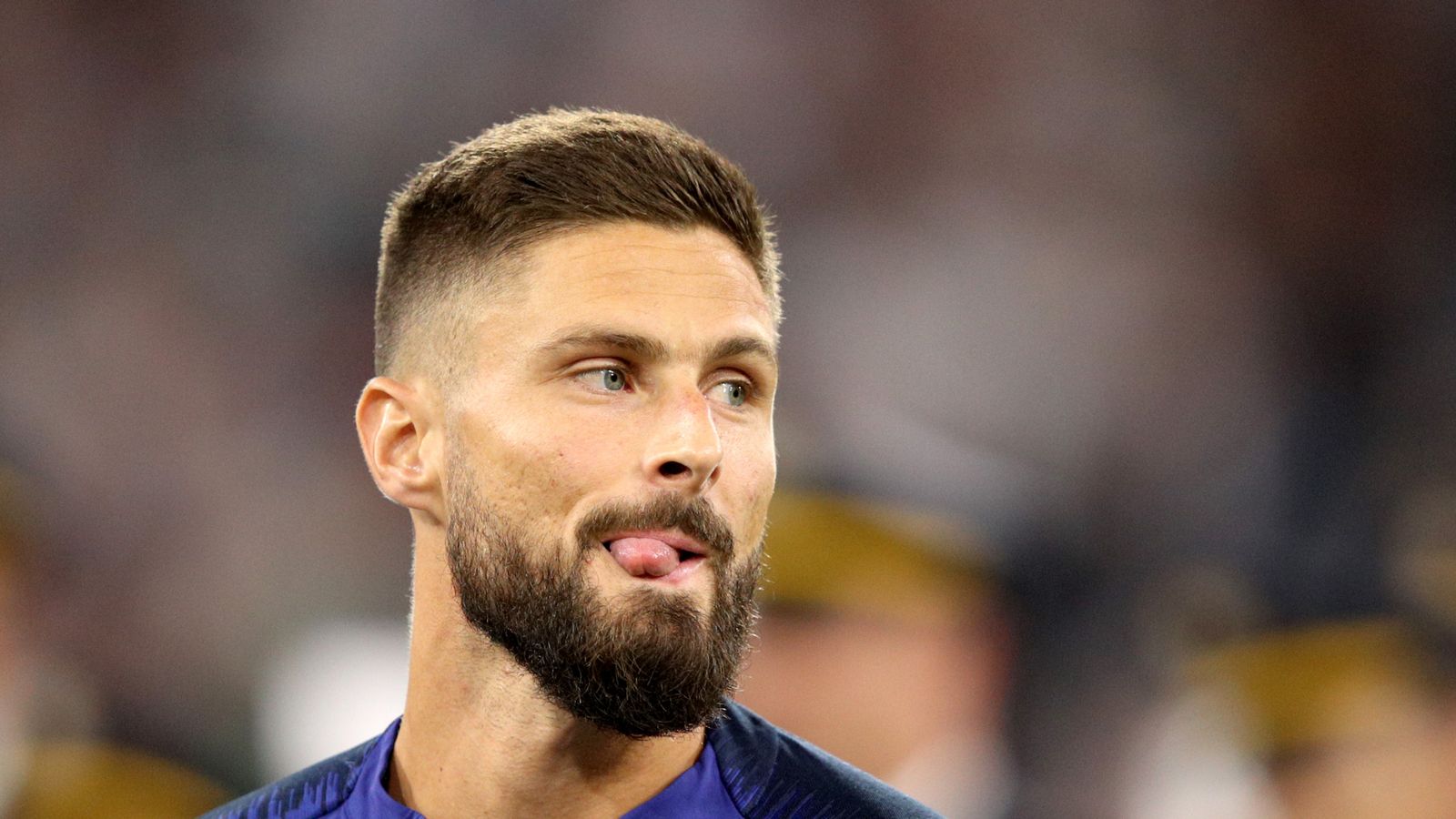  A close-up of French soccer player Olivier Giroud sticking his tongue out while playing for France.