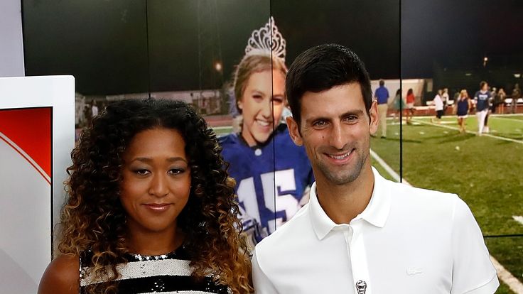 Novak Djokovic of Serbia and Naomi Osaka of Japan hold their winners trophies at NBC's TODAY Show on September 10, 2018 in New York City. 