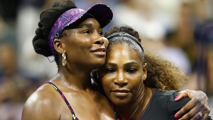 Venus Williams congratulates sister Serena (right) after their third-round match at the US Open