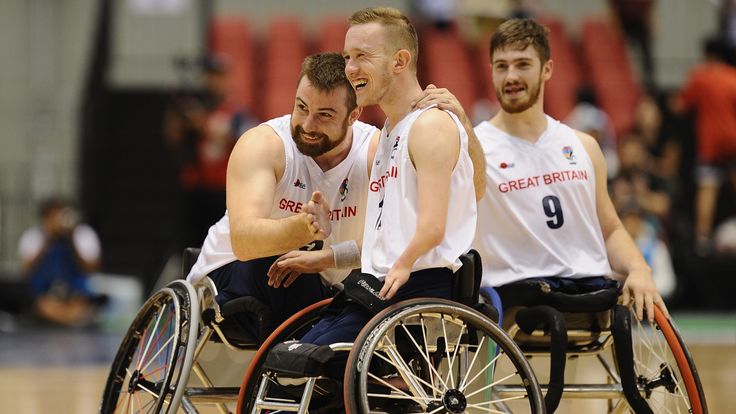 Simon Brown, Gregg Warburton and Harrison Brown of Great Britain celebrate victory during the Wheelchair Basketball World Challenge Cup match between Great Britain and Japan at the Tokyo Metropolitan Gymnasium on September 1, 2017 in Tokyo, Japan