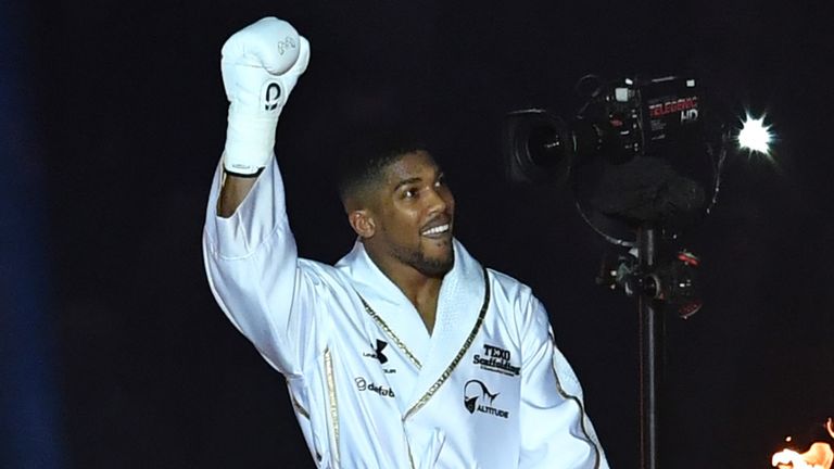 Britain's Anthony Joshua makes his way to the ring ahead of his IBF, IBO and WBA, world Heavyweight title fight against Ukraine's Wladimir Klitschko at Wembley Stadium in north west London on April 29, 2017.
