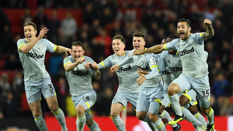 Derby players celebrate their shoot-out win at Old Trafford