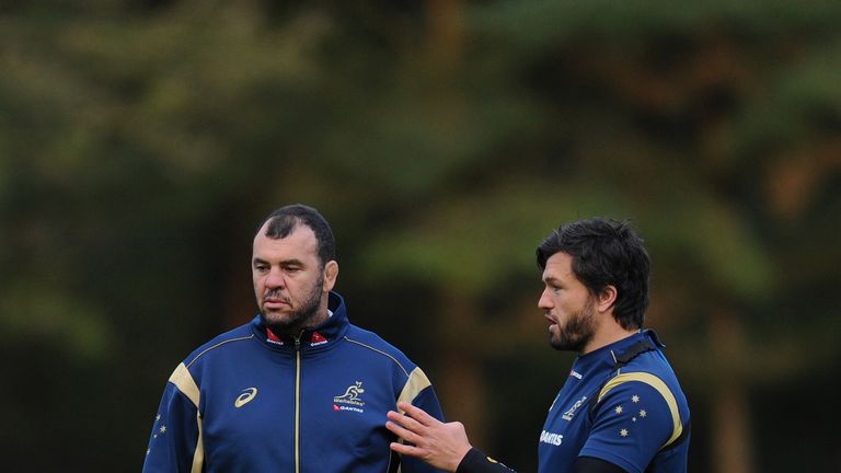 Australia Wallabies player Adam Ashley-Cooper (r) makes a point to head coach Michael Cheika during a Wallabies training session at Treforest on November 4, 2014 in Cardiff, Wales.