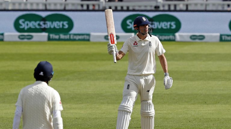 Alastair Cook acknowledges the crowd after passing 50