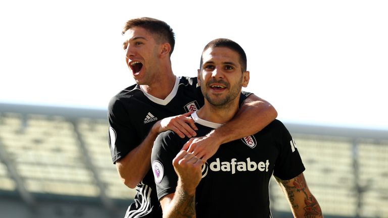 Aleksandar Mitrovic celebrates with Fulham teammate Luciano Vietto