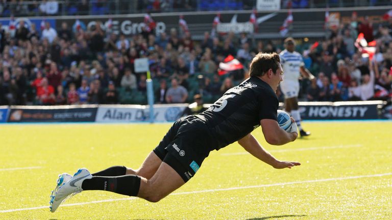 Alex Goode of Saracens goes past Darren Atkins to set up a try for Liam Williams during the Gallagher Premiership Rugby match between Saracens and Bath Rugby at Allianz Park on September 29, 2018 in Barnet, United Kingdom