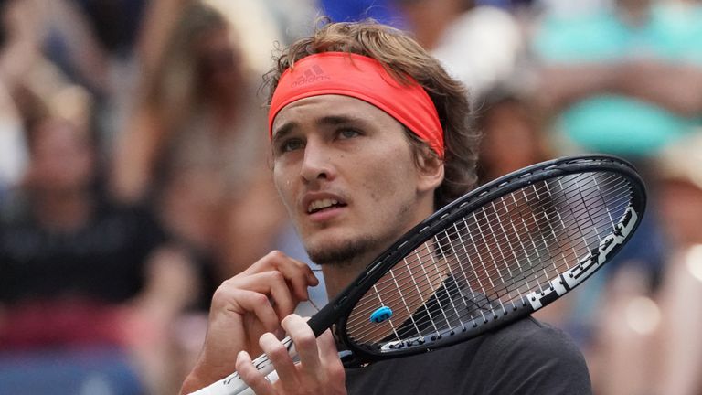 Alexander Zverev of Germany adjusts his necklace while playing Philipp Kohlschreiber of Germanyduring their 2018 US Open men's round 3 match on September 1, 2018 in New York. 