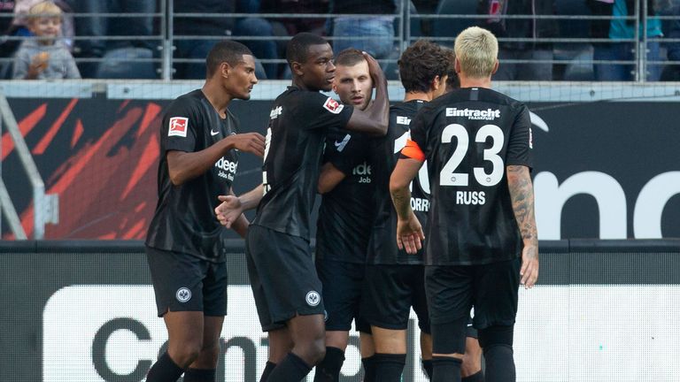  Ante Rebic of Frankfurt (C) is hugged by teammates after scoring the second goal during the Bundesliga match between Eintracht Frankfurt and Hannover 96