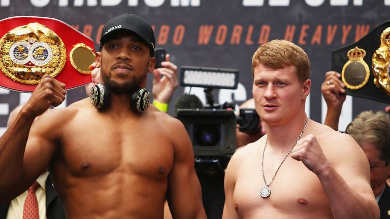 Anthony Joshua And Alexander Povetkin pose for the cameras during the Anthony Joshua And Alexander Povetkin weigh in on September 21, 2018 in London, England.
