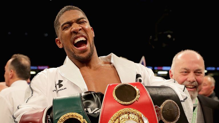 Anthony Joshua celebrates his points victory over Joseph Parker at the Principality Stadium on March 31, 2018