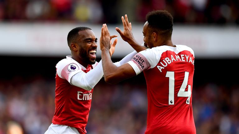 Arsenal's Alexandre Lacazette (left) and Arsenal's Pierre-Emerick Aubameyang (right) celebrate after West Ham United's Issa Diop scores an own-goal for their side's second goal during the Premier League match at the Emirates Stadium, London.