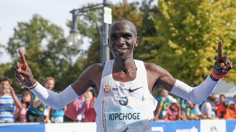 Eliud Kipchoge crosses the finish line of the Berlin Marathon in a world record time
