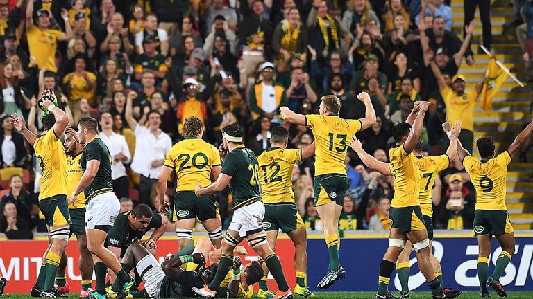 Australia celebrate a hard fought win over South Africa.