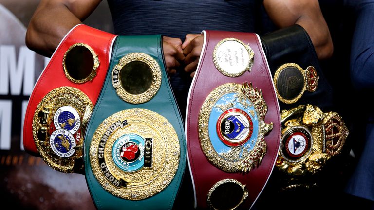 Detail of the IBF, WBO, IBO and WBA World Heavyweight belts held by Anthony Joshua during the pre-fight press conference on September 20, 2018 