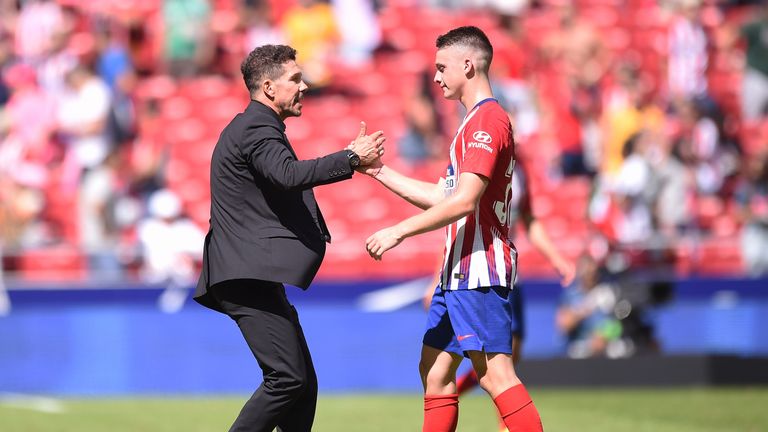 Borja Garces is congratualted by Diego Simeone after his late equaliser for Atletico Madrid