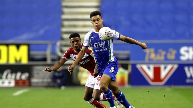 Bristol City's Niclas Eliasson (left) and Wigan Athletic's Antonee Robinson (right) battle for the ball during the Sky Bet Championship match at the DW Stadium, Wigan
