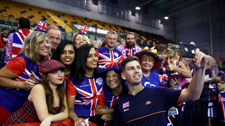 Cameron Norrie of Great Britain celebrates with fans after winning his match against Sanjar Fayziev of Uzbekistan during day three of the Davis Cup by BNP Paribas World Group Play off between Great Britain and Uzbekistan at Emirates Arena on September 16, 2018 in Glasgow, Scotland. 