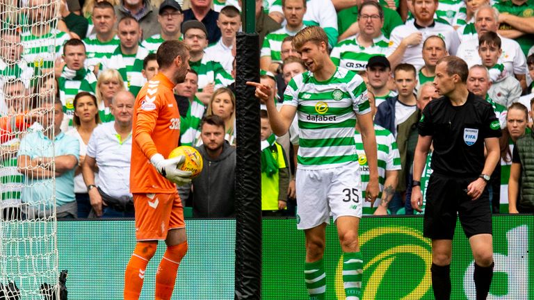 Celtic's Kristoffer Ajer (right) exchanges words with Rangers' Allan McGregor 