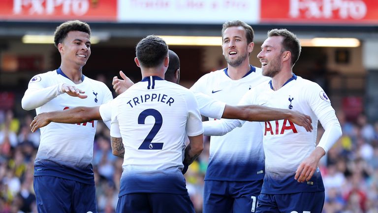 Christian Eriksen of Tottenham Hotspur (23) and team mates celebrate as Abdoulaye Doucoure of Watford scores an own goal for their first goal during the Premier League match between Watford FC and Tottenham Hotspur at Vicarage Road on September 2, 2018 in Watford, United Kingdom.