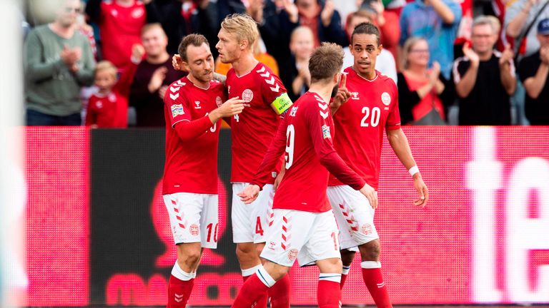 Christian Eriksen (far left) scored both goals for Denmark against Wales