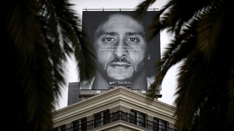 A billboard featuring former 49ers quaterback Colin Kaepernick is displayed on the roof of the Nike Store  in San Francisco