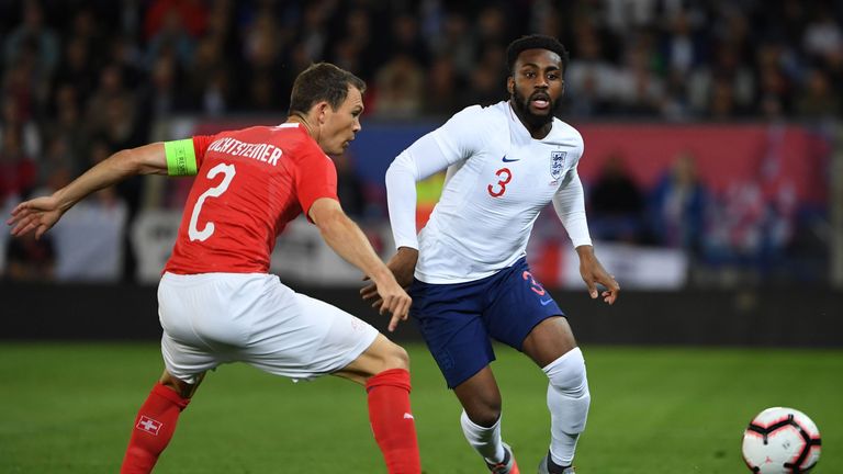 Danny Rose and Stephan Lichsteiner in action during England v Switzerland