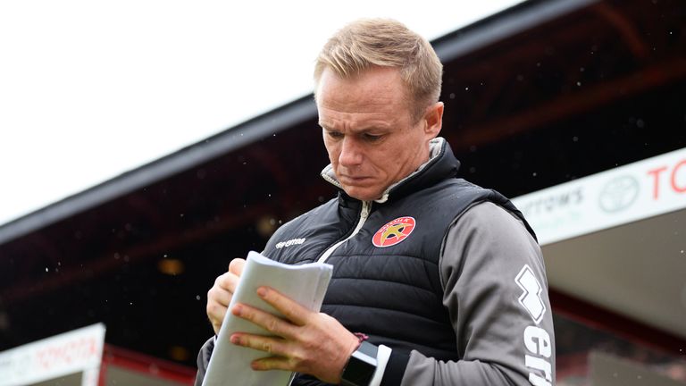 Dean Keates makes notes during Walsall's League One away game at Barnsley's Oakwell Stadium in September 2018