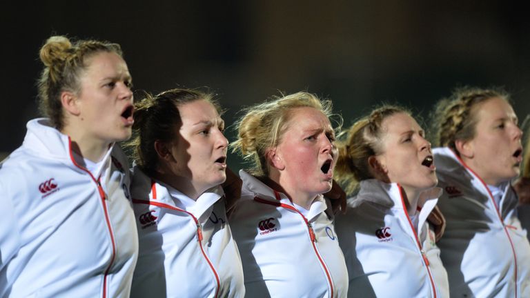 Danielle Waterman of England (L4), and Izzy Noel-Smith (L3), of England sing the National Anthem during the Natwest Women's Six Nations match between Scotland Women and England Women at Scotstoun Stadium