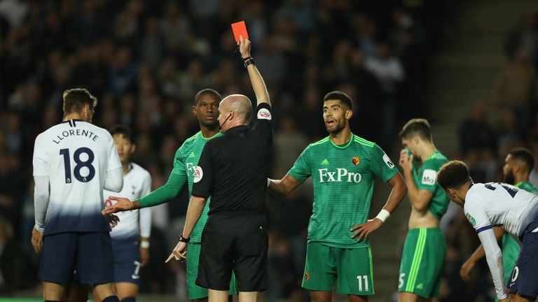 Christian Kabasele is shown a red card by referee Lee Mason