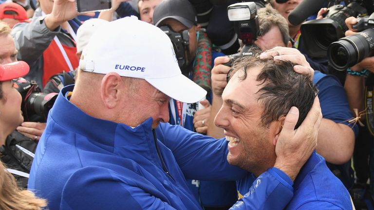Francesco Molinari of Europe celebrates winning The Ryder Cup with Captain Thomas Bjorn of Europe during singles matches of the 2018 Ryder Cup at Le Golf National on September 30, 2018 in Paris, France