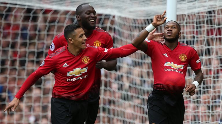 Fred celebrates his goal with Alexis Sanchez and Romelu Lukaku