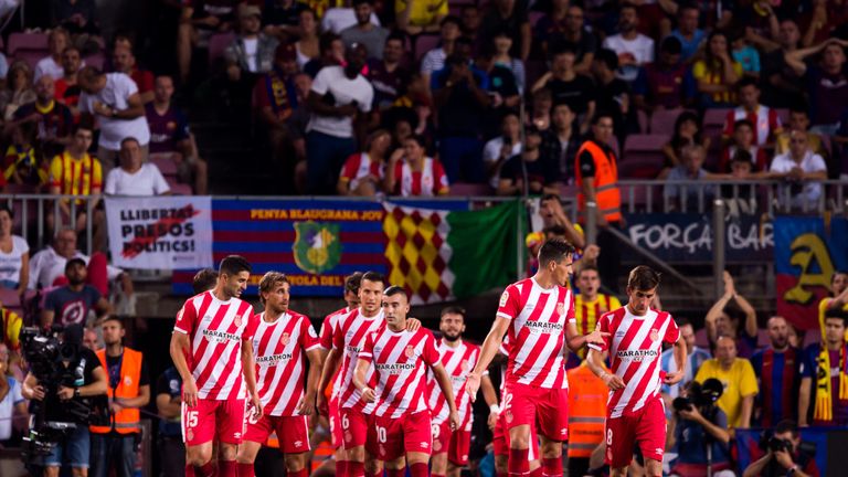 Girona celebrate scoring against Barcelona