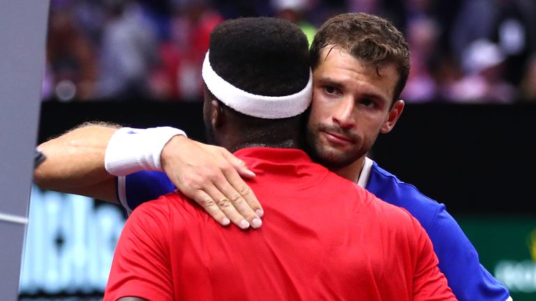 Team Europe Grigor Dimitrov of of Bulgaria hugs Team World Frances Tiafoe of the United States after defeating him in their Men's Singles match on day one of the 2018 Laver Cup at the United Center on September 21, 2018 in Chicago, Illinois.