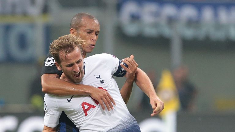 Harry Kane (front) of Tottenham Hotspur competes for the ball with Joao Miranda de Souza Filho of FC Internazionale during the Group B match of the UEFA Champions League between FC Internazionale and Tottenham Hotspur at San Siro Stadium on September 18, 2018 in Milan, Italy