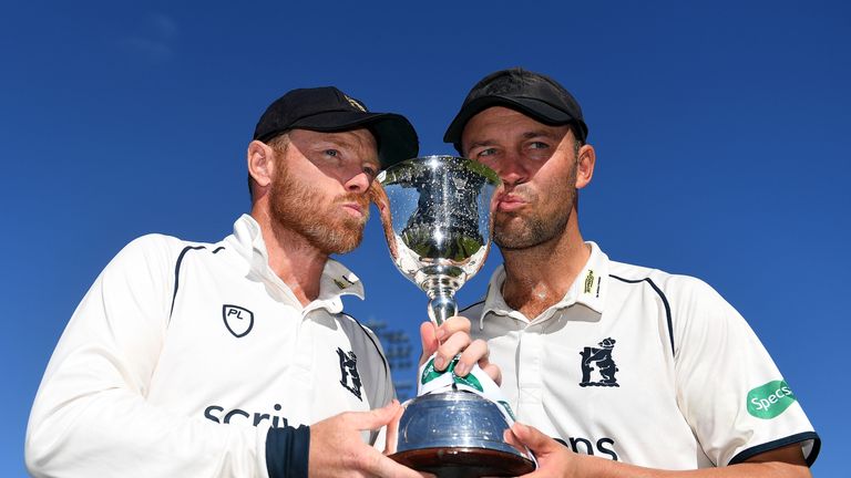 Ian Bell and Jonathan Trott of Warwickshire pose with the trophy after winning Division Two during Day Three of the Specsavers County Championship Division Two match between Warwickshire and Kent at Edgbaston on September 26, 2018 in Birmingham, England.  (Photo by Harry Trump/Getty Images)