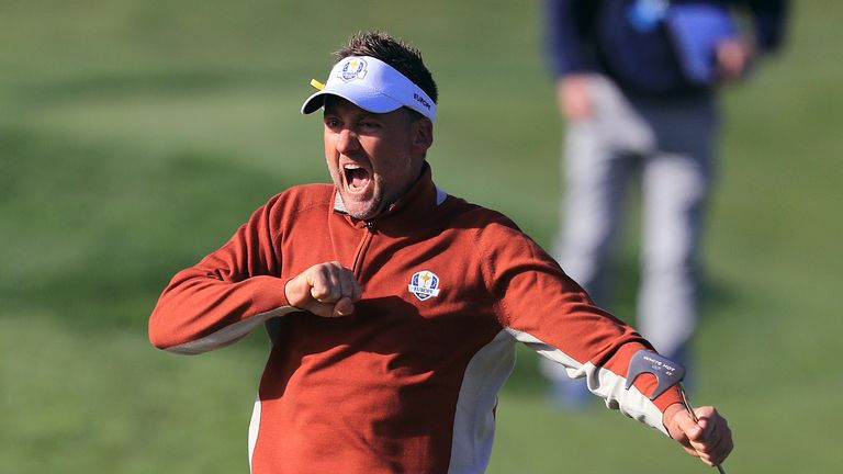 Team Europe's Ian Poulter celebrates his putt on the seventh green 