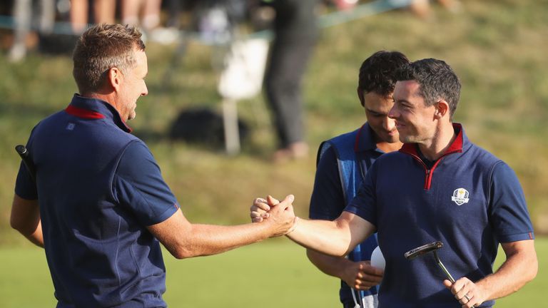Ian Poulter and Rory McIlroy celebrate winning their Ryder Cup foursomes match