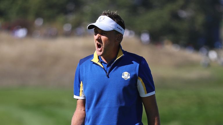 Europe's Ian Poulter celebrates his putt on the fourth hole