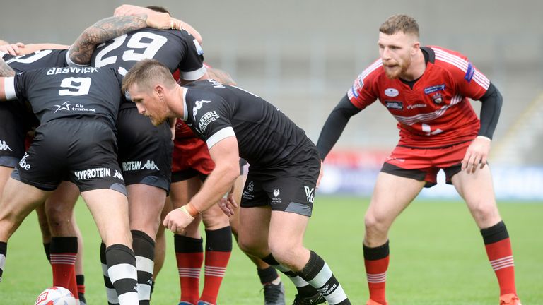 Picture by Dean Atkins/SWpix.com - 08/09/2018 - Rugby League - Betfred Super League - The Qualifiers - Salford Red Devils v Toronto Wolfpack - AJ Bell Stadium, Salford, England -.Toronto's Josh McCrone takes from the scrum as Jackson hastings watches on