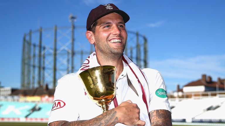 Jade Dernbach celebrates with the County Championship trophy