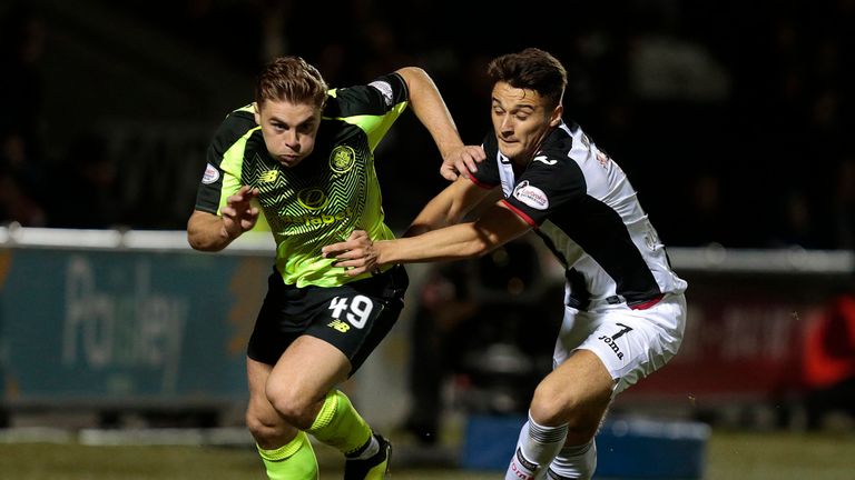 St Mirren's Kyle Magennis (right) and Celtic's James Forrest battle for the ball 