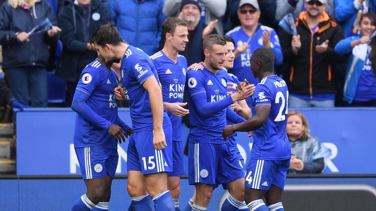 Jamie Vardy is congratulated by team-mates after scoring Leicester City's third goal