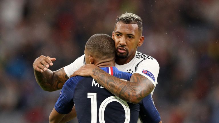 Jerome Boateng hugs PSG and France forward Kylian Mbappe during last week's friendly